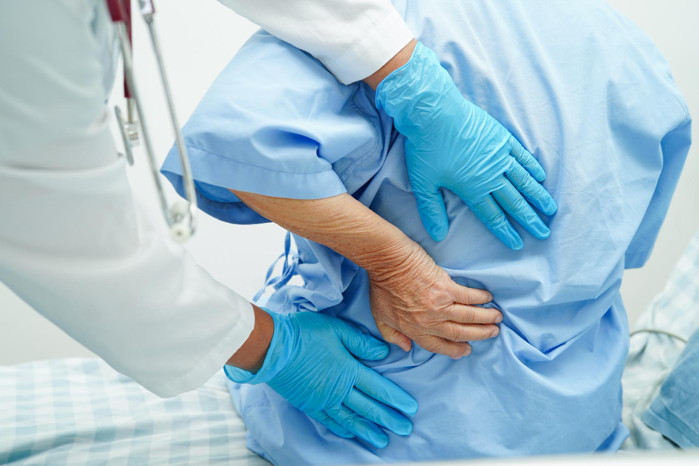 doctor examine treat asian elderly patient muscle back pain problem physical therapy hospital