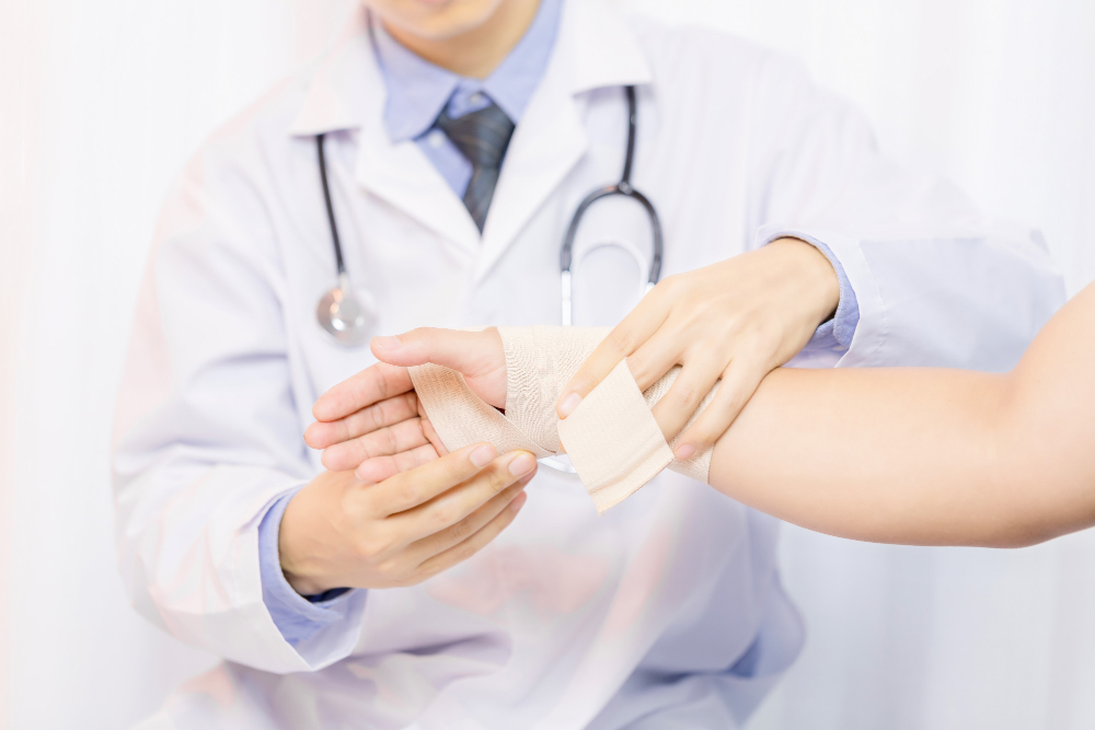 male-doctor-putting-gauze-young-man-s-hand-clinic-closeup-first-aid