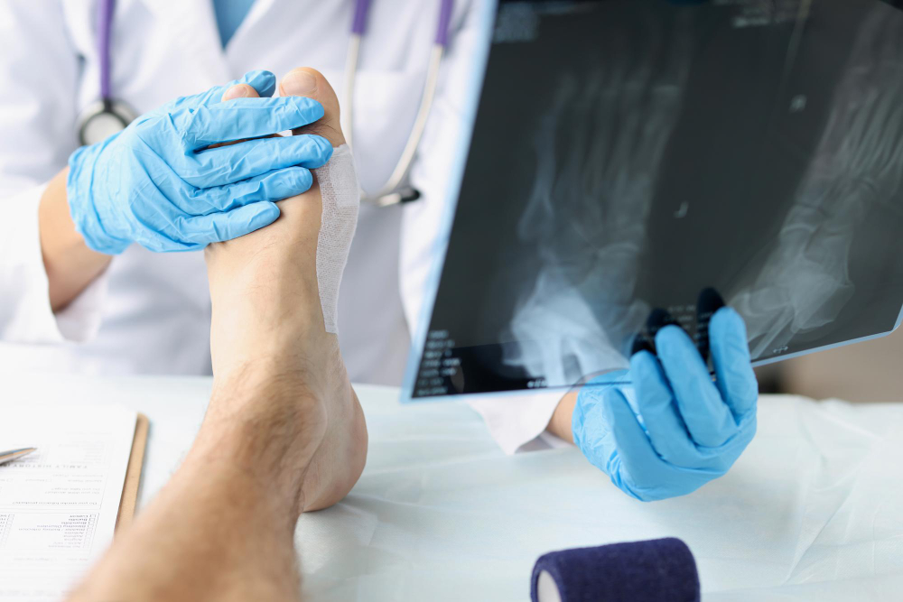 traumatologist looking xray foot examining patient